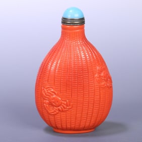 A Qing Qianlong coral-colored glazed snuff bottle