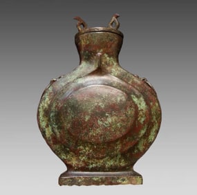 A bronze flat pot