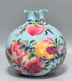 A Qing Qianlong year climbing turquoise green pomegranate bottle
