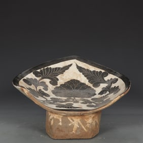 A piece of Northern Song Dynasty Cizhou kiln white ground peony pattern lotus leaf pillow