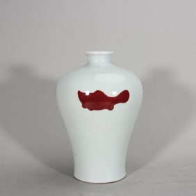 A Qing Qianlong glazed red three-fish plum bottle