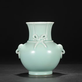 A Qing Dynasty Qianlong sky blue glazed elephant ear bamboo basket bottle