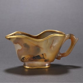 A piece of agate enveloped gold cup