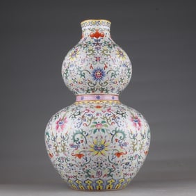 A Qing Qianlong pastel gold-painted entwined lotus flower gourd bottle