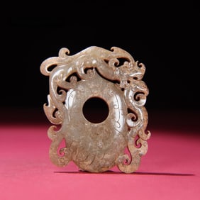 A jade dragon chicken heart pendant of the Han Dynasty