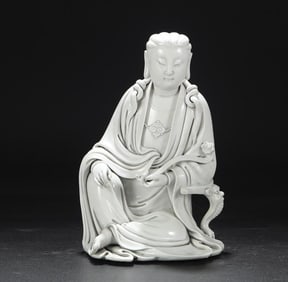 A Ming Dynasty Dehua kiln ivory white glaze holding a ruyi Buddha statue