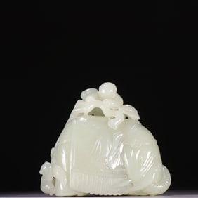 A Qing Dynasty Hetian jade boy elephant carving