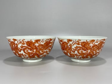 A pair of Kangxi imperial alum red nine dragon bowls