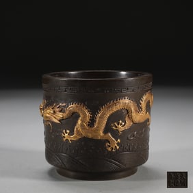 A late Ming Dynasty copper-tired gilt double dragon bead-patterned cylinder furnace
