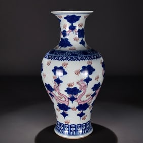 A Qing Jiaqing blue and white auspicious cloud jewel red dragon pattern fishtail statue
