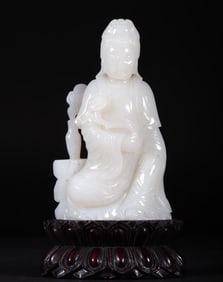A seated statue of Guanyin made of Tian Yu seed material in the Qing Dynasty