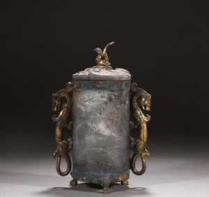 A Han bronze jade inlaid vermilion bird stepping tiger double dragon ear cup
