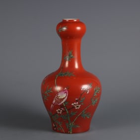 A garlic vase made in the Qing Yongzheng era with a coral red background and pastel flower and bird