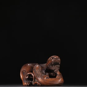 A carving of a Qing agarwood mother beast