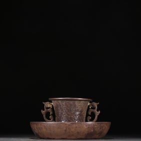 A Qing Dynasty sterling silver cup holder