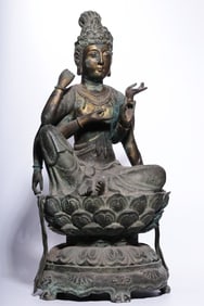 A bronze gilt engraved four-armed Guanyin seated statue of the Qing Dynasty "Tang Dynasty Year"
