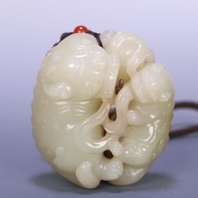 A Qing Dynasty Hetian jade double lion play hydrangea handle
