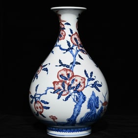 A Qing Qianlong blue and white glazed red Fushou pattern jade pot spring vase