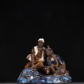 A porcelain sculpture of a mine war figure in Shiwan kiln
