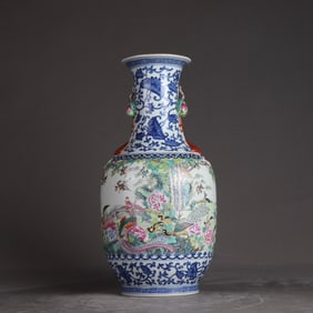 A Qing Qianlong blue and white entwined branch window enamel flower and bird picture ruyi amphora
