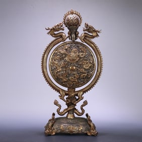 A copy of the imperial court copper gilt nine dragon bead turning screen