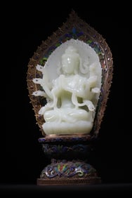 A statue of Guanyin with a thousand hands in pure silver, gilt and white jade from the Qing Dynasty