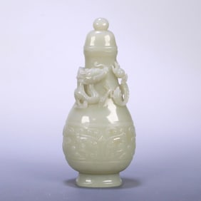 A late Qing Hetian jade gluttonous dragon pattern bottle.