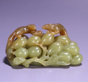 A late Qing Dynasty Hetian topaz squirrel grape ornament
