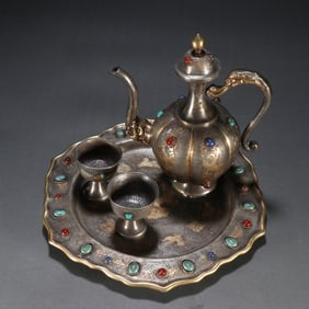 A set of copper gilt dragon and phoenix pattern wine sets