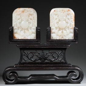 A pair of Qing Dynasty Hetian jade dragon play beads inserted