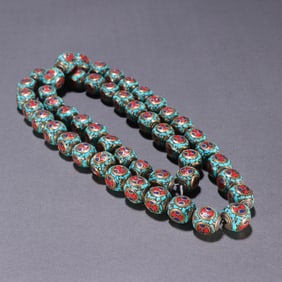 A string of gilded turquoise beads