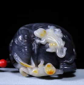 A Qing Dynasty Hetian jade blue and white marquis worship ornament