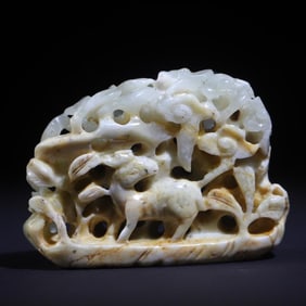 A white jade boy herding cattle from the Qing Dynasty stove top