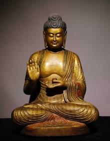 A Tang bluestone gilt painted Buddha statue