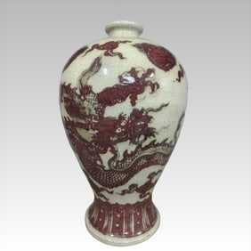 A Ming Dynasty glazed red dragon pattern plum bottle