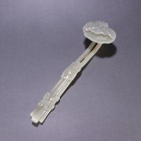 A Qing Dynasty Hetian jade lotus leaf pattern ruyi handle