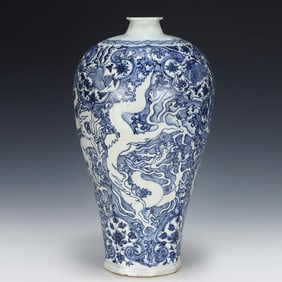 A Yuan blue and white seawater carved dragon pattern eight-aya plum bottle