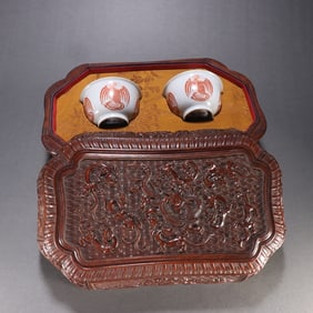 A pair of Qing Dynasty official kiln alum red phoenix pattern cups