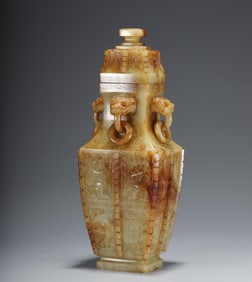 A Qing Dynasty Hetian topaz with a halberd beast face pattern bottle