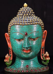 A copper-inlaid turquoise Buddha head mask from the Qing Dynasty