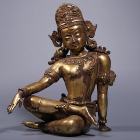 A Qing Dynasty bronze gilt free Guanyin seated statue