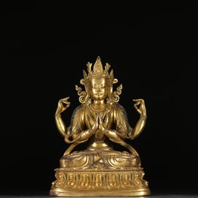 A Qing Dynasty bronze gilt four-armed Guanyin statue