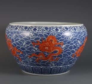 A blue and white alum red seawater five-dragon pattern calligraphy and painting jar made in the