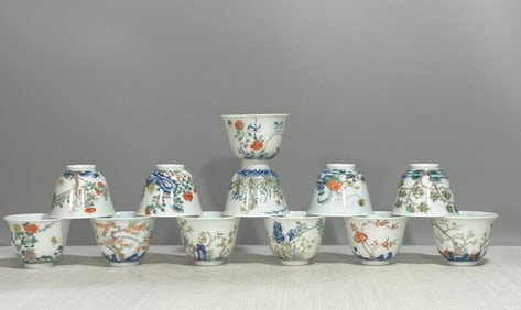 A set of Qingkang ? blue and white Doucai Twelve Flower God Cups