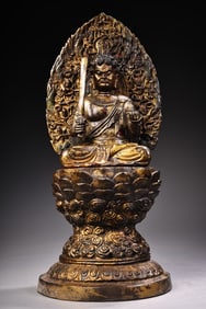 A high-relief engraving of a Buddha statue of the Buddha King of the Immovable Ming King