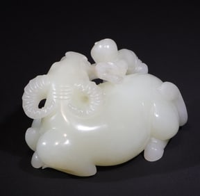 A white jade carved boy playing with a cow in the Qing Dynasty auspicious treasure