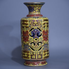 A yellow enamel openwork core vase