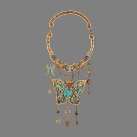 A Qing Dynasty filigree dotted emerald butterfly is listed