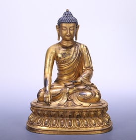 A 19th-century Tibetan bronze gilt statue of Shakyamuni