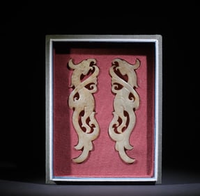 A pair of double dragon jade pendants of the Han Dynasty